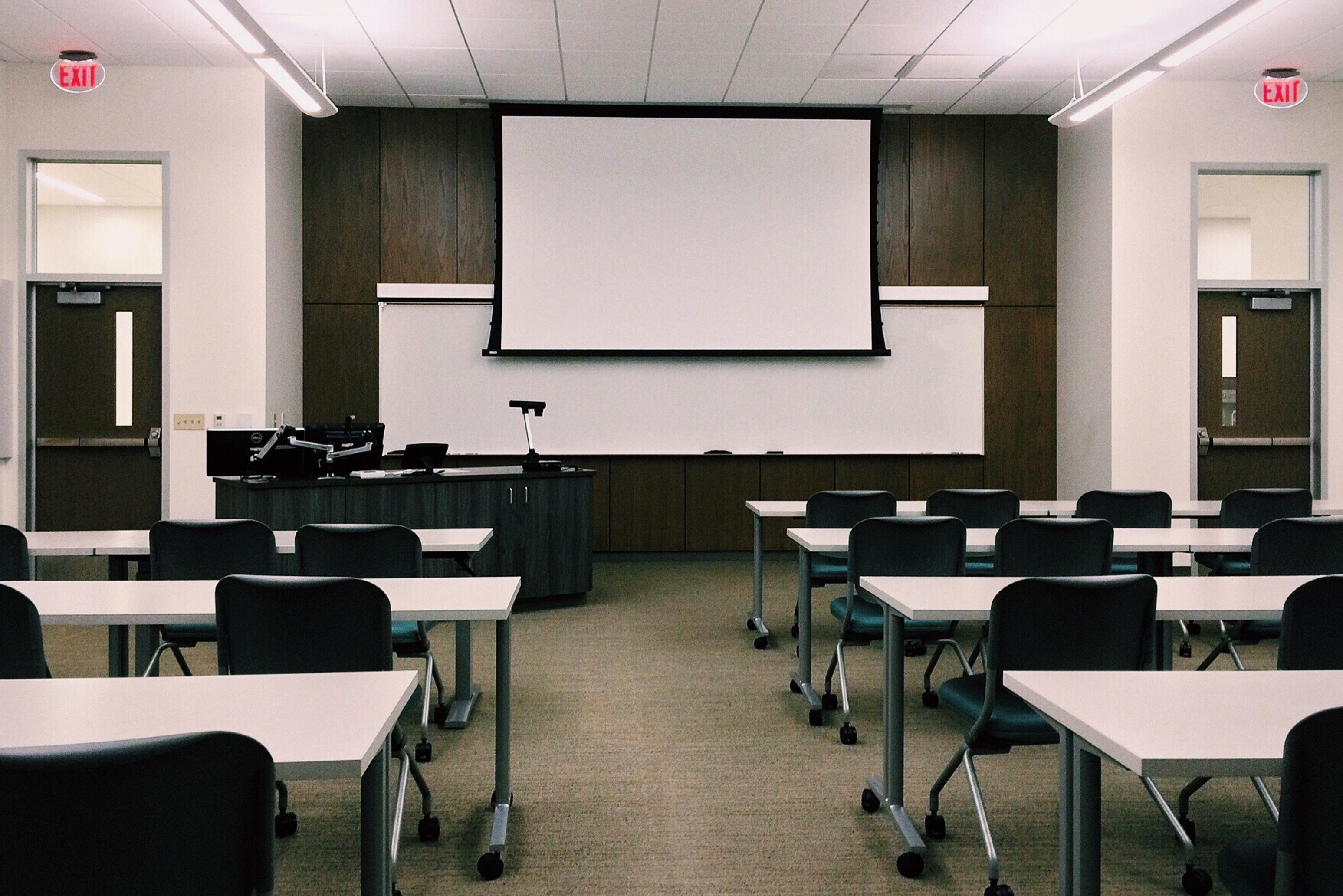 Canva - Empty Classroom with White Board